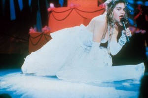 Madonna's Opening Number: A Video Star Is Born (1984) -  Older generations vividly recall the exact moment when they first saw Elvis twitch his pelvis on TV or when the Beatles first performed on Ed Sullivan. But for children of the '80s, one of the most defining televised music moments was when Madonna kicked off the inaugural VMAs. And it wasn't even planned. "I lost [my shoe] and I thought, 'Oh my God, how am I going to get that? It's over there and I'm on TV.' So I thought, 'Well, I'll pretend I meant to do this,' and I dove onto the floor. And I rolled around and I reached for the shoe, and as I reached for the shoe, the dress went up, and then the underpants were showing. And I didn't mean to," Madonna told Jay Leno years later. And thus, VMAs history was made.