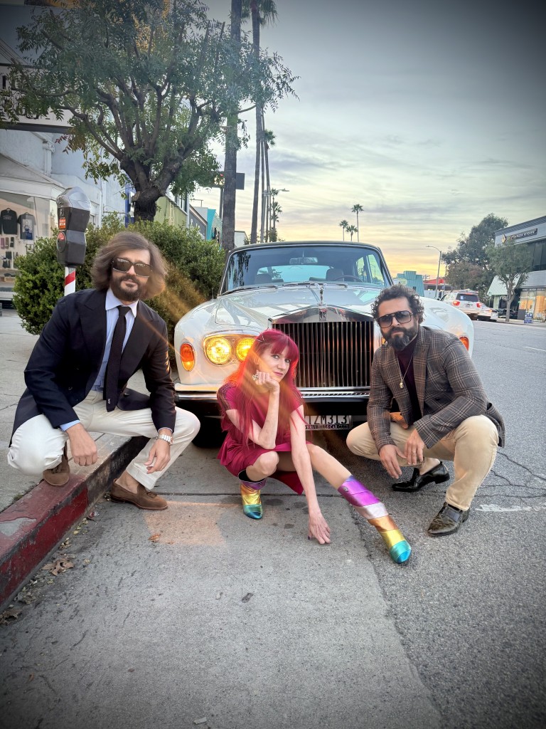 The Dolcevita Brothers, Mr. Ciao and DBone, pose with LPTV host Lyndsey Parker in front of Licorice Pizza Records. (photo: Max Scott)